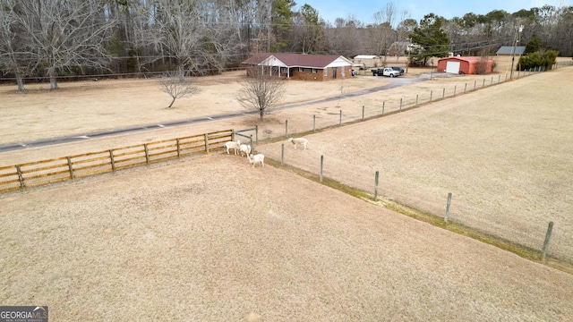 view of yard with a rural view