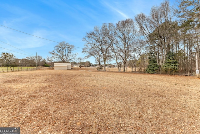 view of yard with a rural view