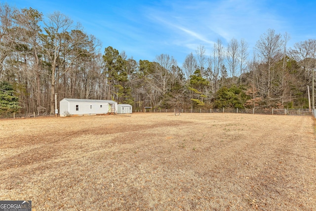 view of yard featuring a storage shed