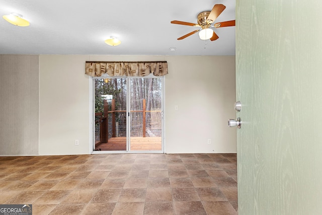 unfurnished room featuring ceiling fan