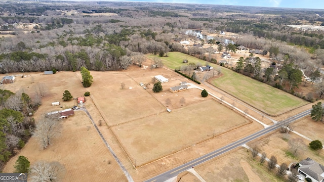 birds eye view of property with a rural view