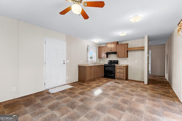 kitchen with black range with electric cooktop, sink, and ceiling fan