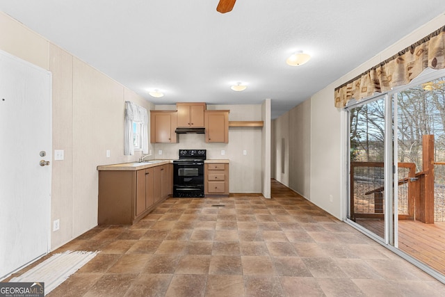 kitchen with sink, black electric range, and light brown cabinets