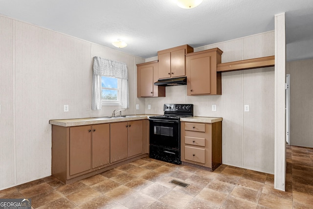 kitchen featuring sink, black electric range, and a textured ceiling