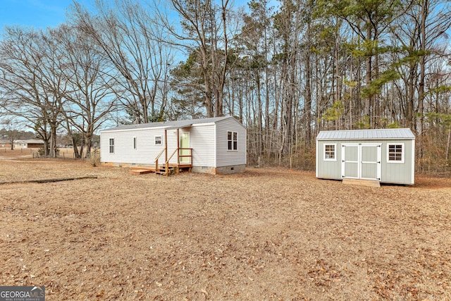 exterior space featuring a storage unit