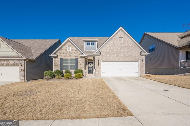 craftsman-style home with a garage and a front yard