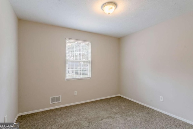 empty room with carpet floors