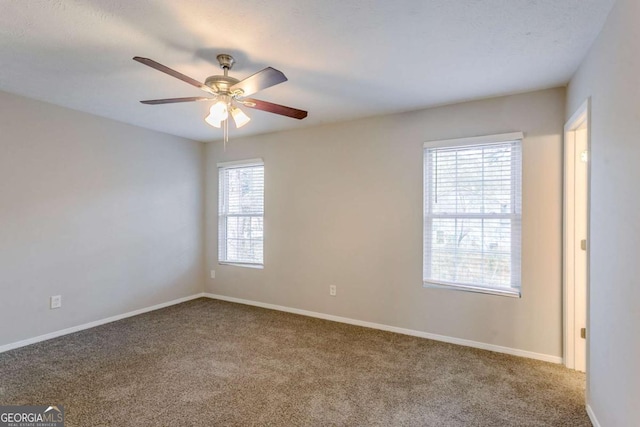 carpeted empty room with ceiling fan