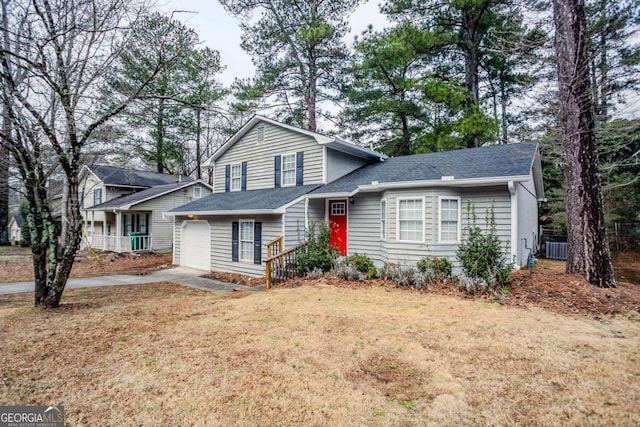 view of front of property with a garage and a front yard