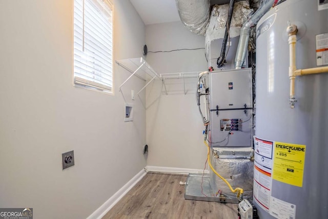 utility room featuring gas water heater