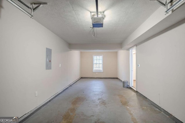 garage featuring a garage door opener and electric panel