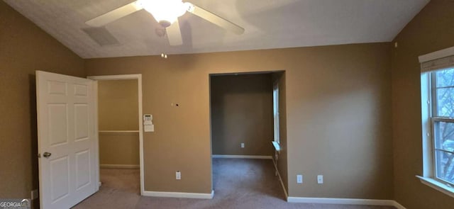 unfurnished bedroom with light carpet, a closet, and ceiling fan