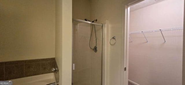 bathroom with a shower with door