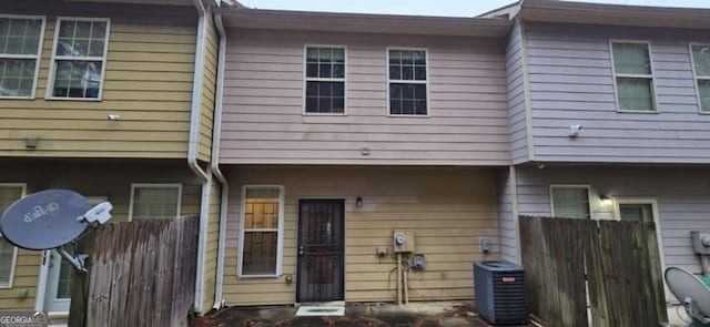 rear view of house with central air condition unit