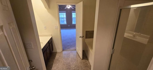 bathroom featuring vanity and a shower with shower door