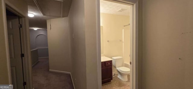 hallway featuring a textured ceiling