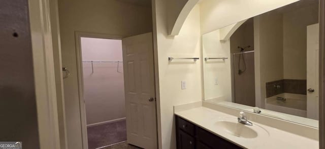 bathroom featuring independent shower and bath and vanity