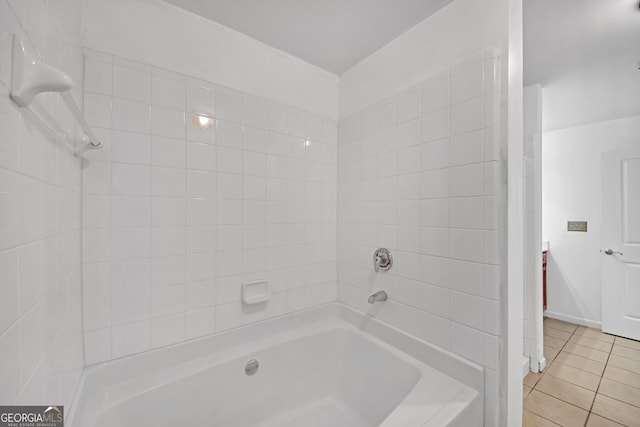 bathroom featuring tile patterned flooring and tiled shower / bath combo