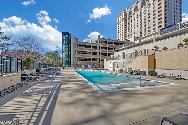 view of swimming pool with a patio