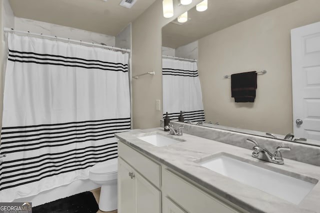 bathroom with vanity and toilet