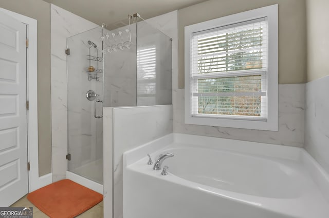 bathroom with independent shower and bath