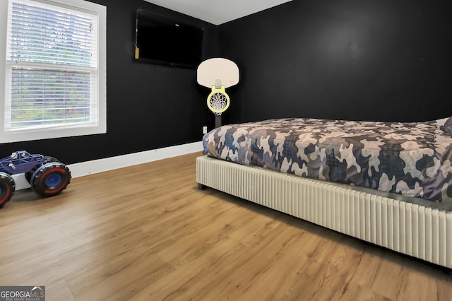 bedroom with light hardwood / wood-style flooring