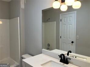 full bathroom with vanity, toilet, and shower / bath combination