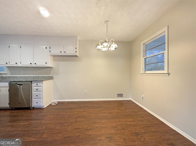 kitchen with pendant lighting, white cabinetry, dark hardwood / wood-style flooring, and dishwasher