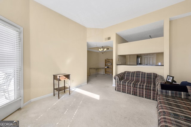 living room with lofted ceiling, carpet flooring, and a notable chandelier