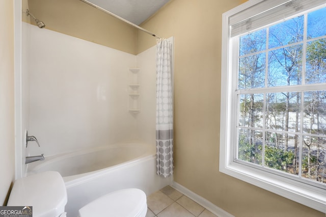 bathroom with shower / bath combo, tile patterned floors, and toilet