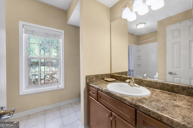 bathroom with tile patterned floors, curtained shower, and vanity