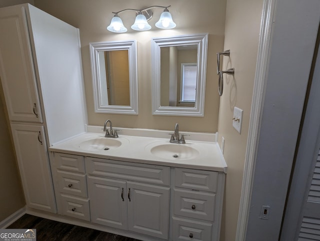 bathroom with vanity and hardwood / wood-style floors