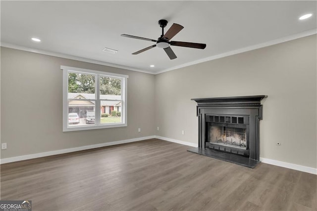 unfurnished living room with ornamental molding, dark hardwood / wood-style floors, and ceiling fan