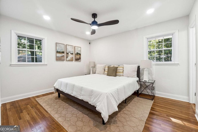 bedroom with hardwood / wood-style flooring and ceiling fan