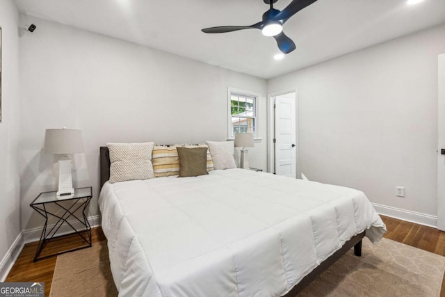 bedroom featuring ceiling fan and dark hardwood / wood-style floors