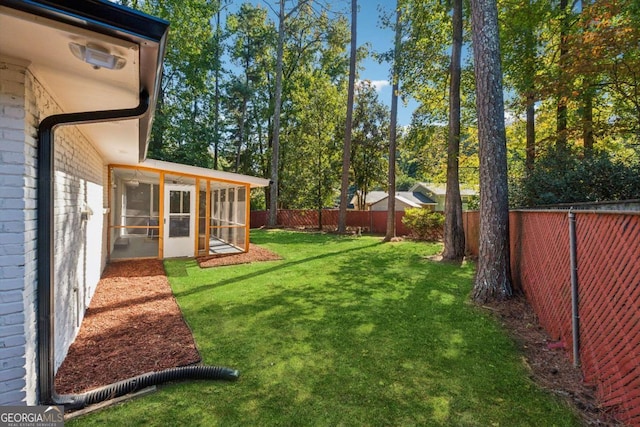 view of yard featuring a sunroom