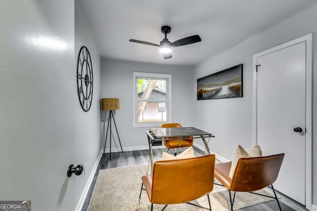 interior space featuring ceiling fan and dark hardwood / wood-style flooring