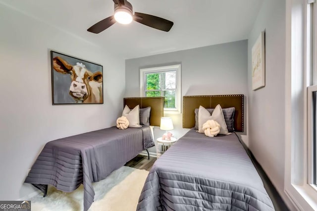 bedroom with ceiling fan and light hardwood / wood-style flooring