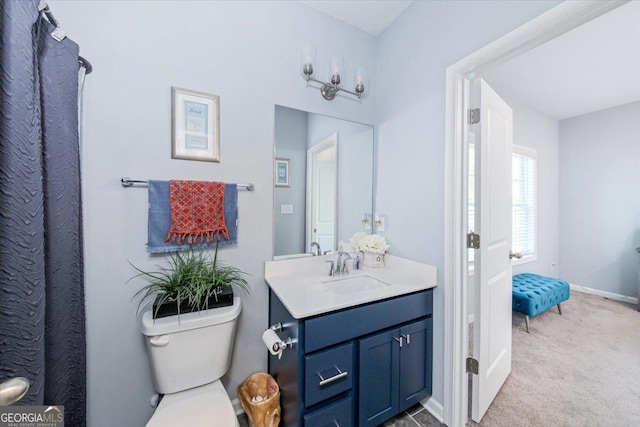 bathroom featuring vanity and toilet