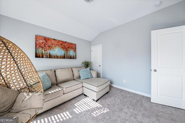 carpeted living room featuring lofted ceiling