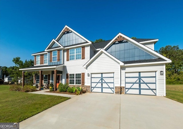 craftsman-style home with a porch, a garage, and a front lawn