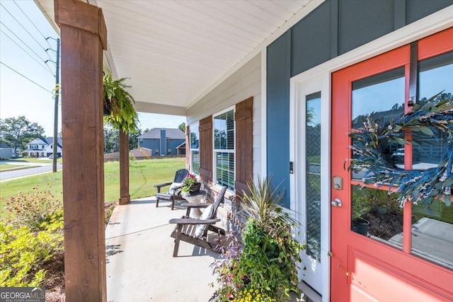 view of patio featuring a porch