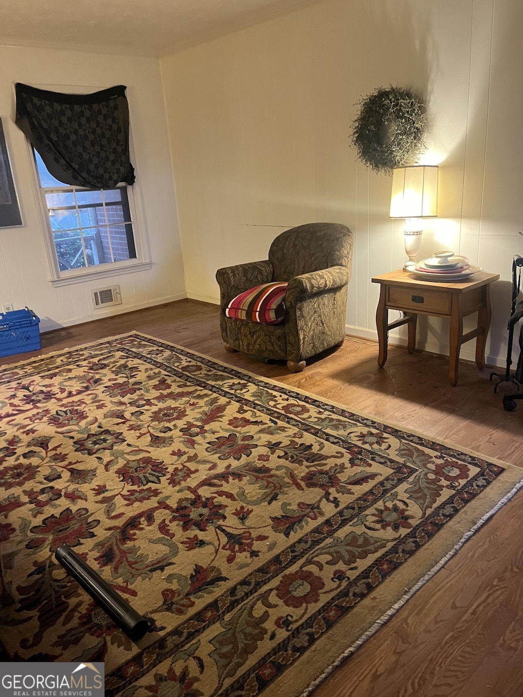 sitting room featuring hardwood / wood-style flooring