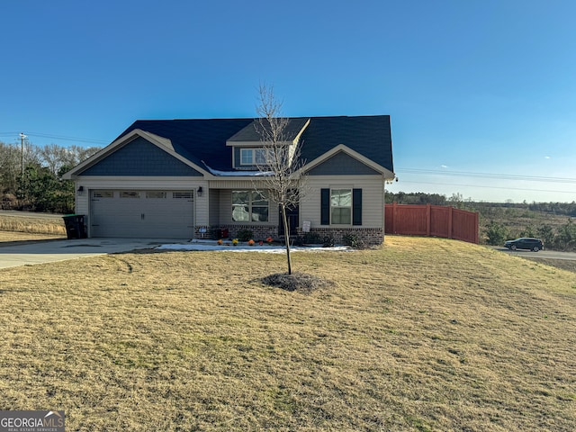 view of front of home featuring a garage and a front yard