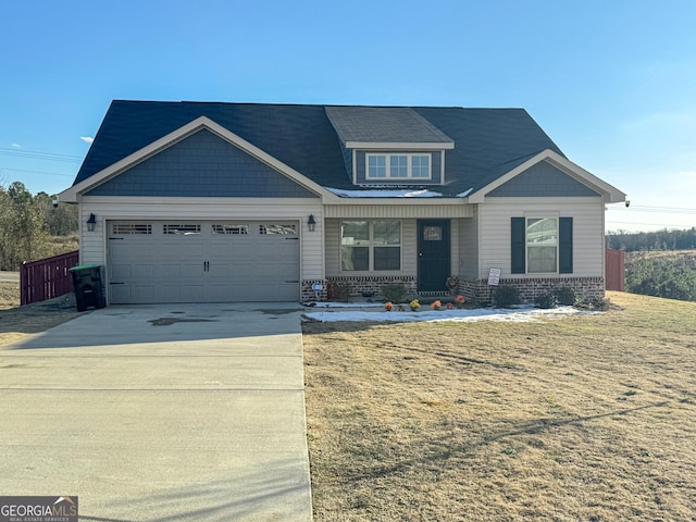 craftsman inspired home with a garage and a front lawn