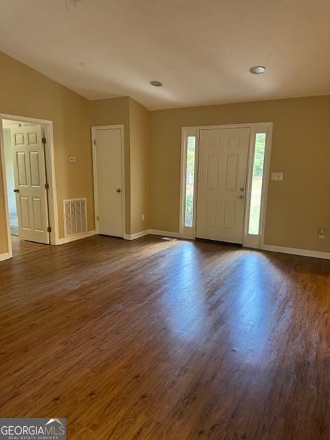 foyer entrance featuring dark hardwood / wood-style floors