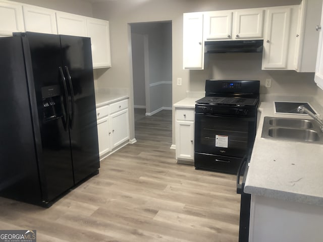 kitchen with white cabinetry, sink, light hardwood / wood-style flooring, and black appliances