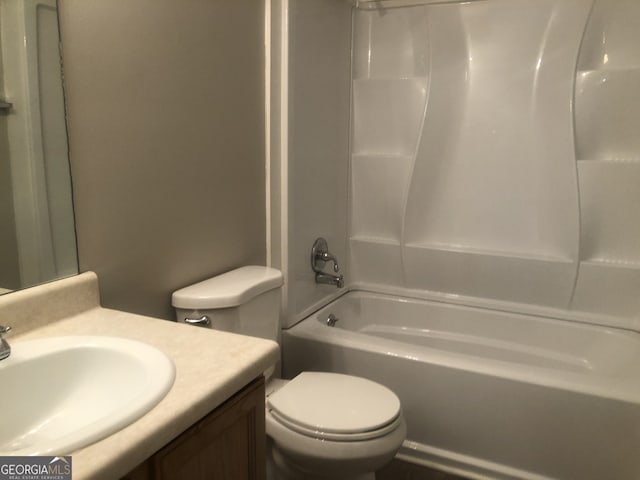 full bathroom with  shower combination, vanity, and toilet