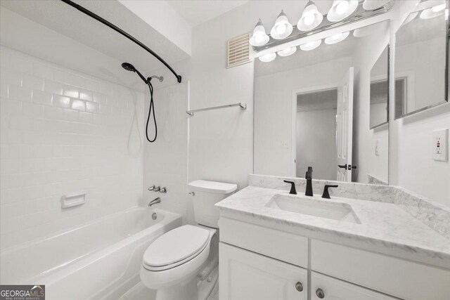 full bathroom featuring shower / tub combination, vanity, and toilet