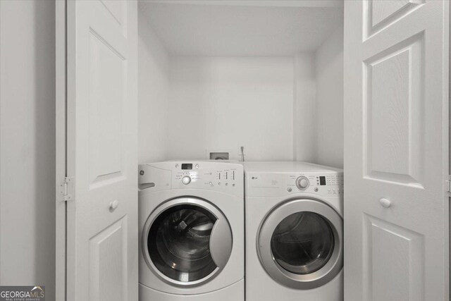 washroom featuring independent washer and dryer